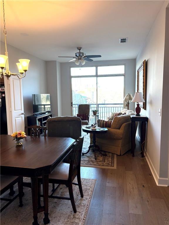 2626 Peachtree Road Northwest, Unit 704 Atlanta, GA 30305 - Photo 7 of 23 a view of a dining room with furniture window and outside view