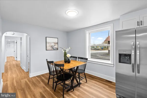 a dining room with furniture and window
