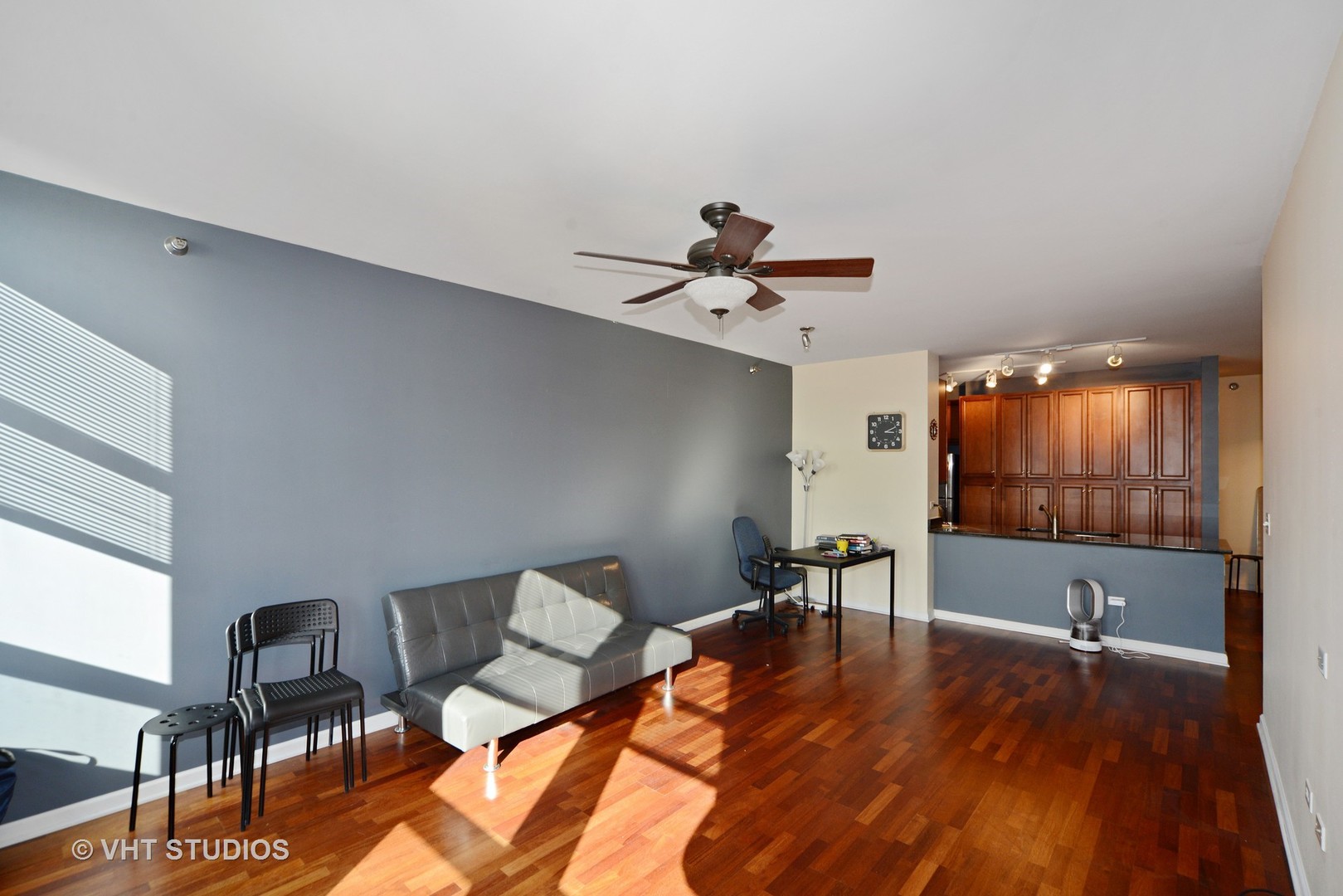 1255 South State Street, Unit 1406 Chicago, IL 60605 - Photo 3 of 9 a living room with furniture and a flat screen tv