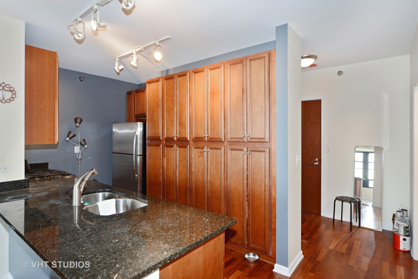 1255 South State Street, Unit 1406 Chicago, IL 60605 - Photo 4 of 9 a kitchen with sink refrigerator and microwave