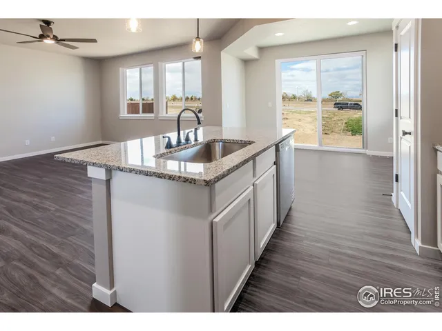 a kitchen with sink and window