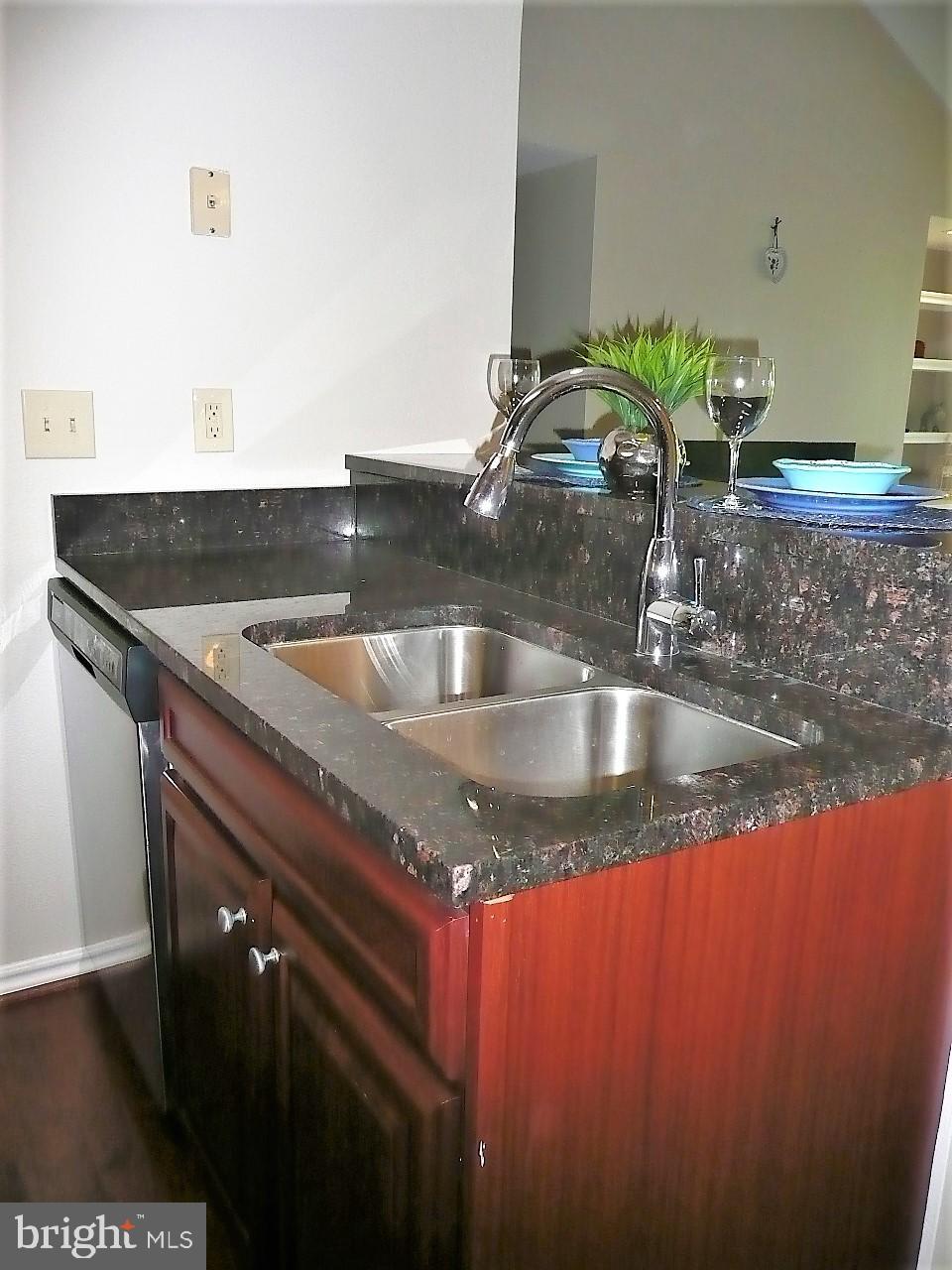 3903 Penderview Drive, Unit 1535 Fairfax, VA 22033 - Photo 11 of 36 a kitchen with granite countertop a sink and a granite counter tops