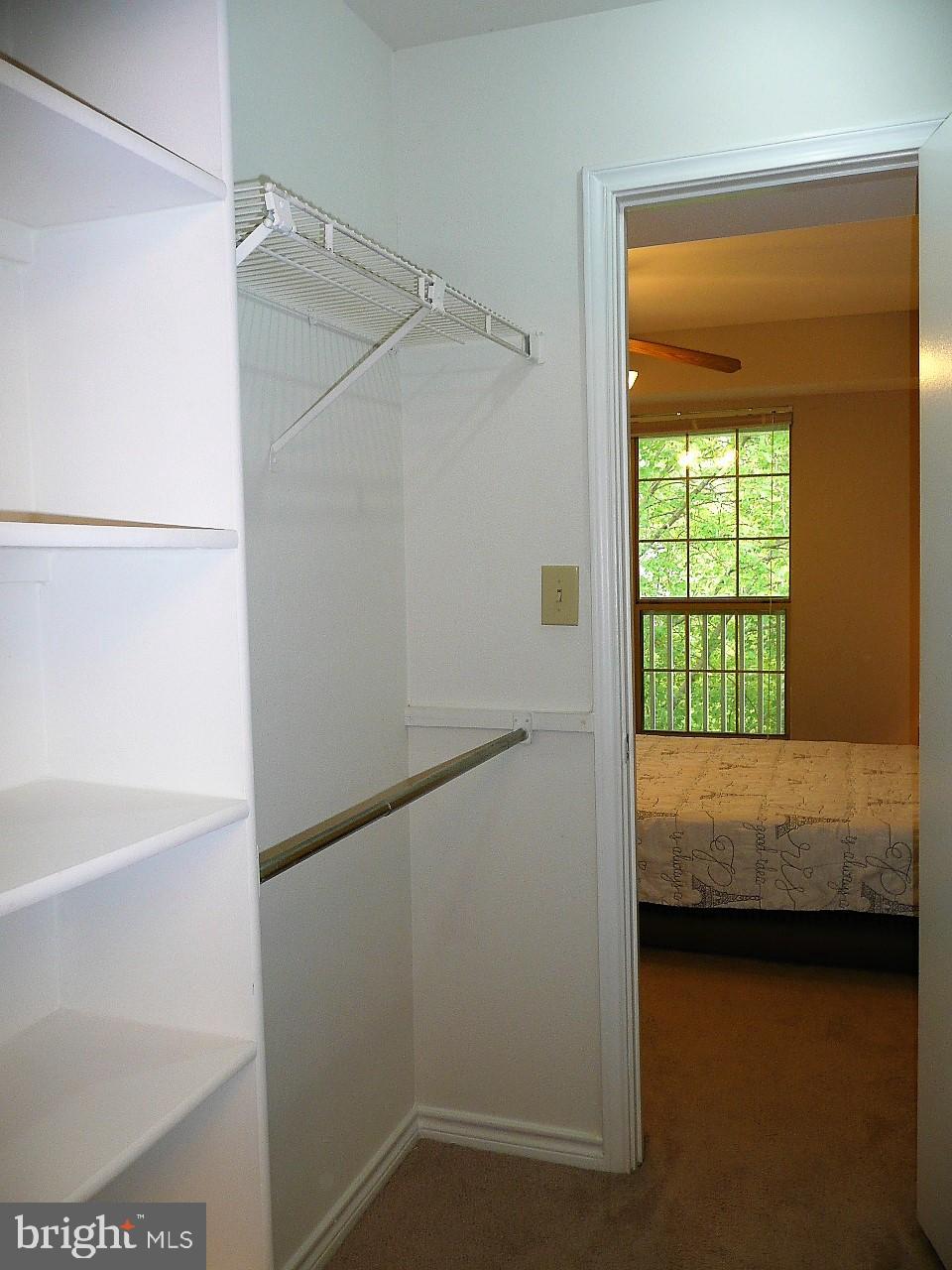 3903 Penderview Drive, Unit 1535 Fairfax, VA 22033 - Photo 17 of 36 a bedroom with a bed and a window