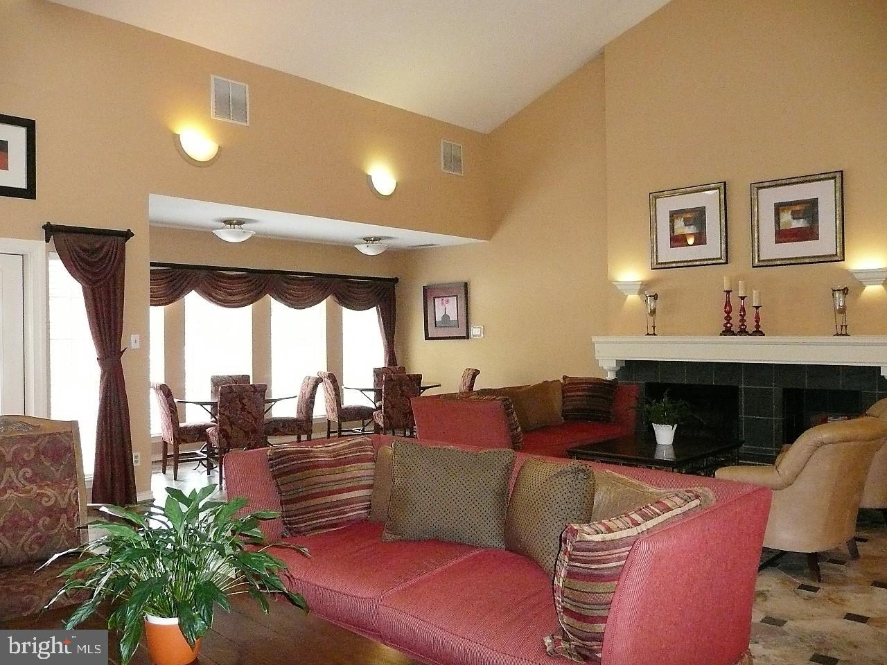 3903 Penderview Drive, Unit 1535 Fairfax, VA 22033 - Photo 26 of 36 a living room with furniture and a fireplace