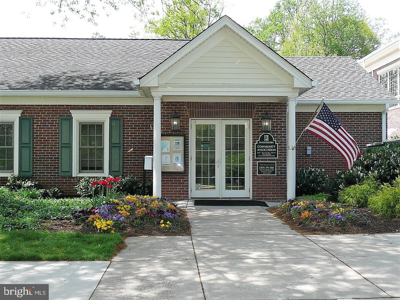 3903 Penderview Drive, Unit 1535 Fairfax, VA 22033 - Photo 30 of 36 a front view of a house with a garden and potted plants
