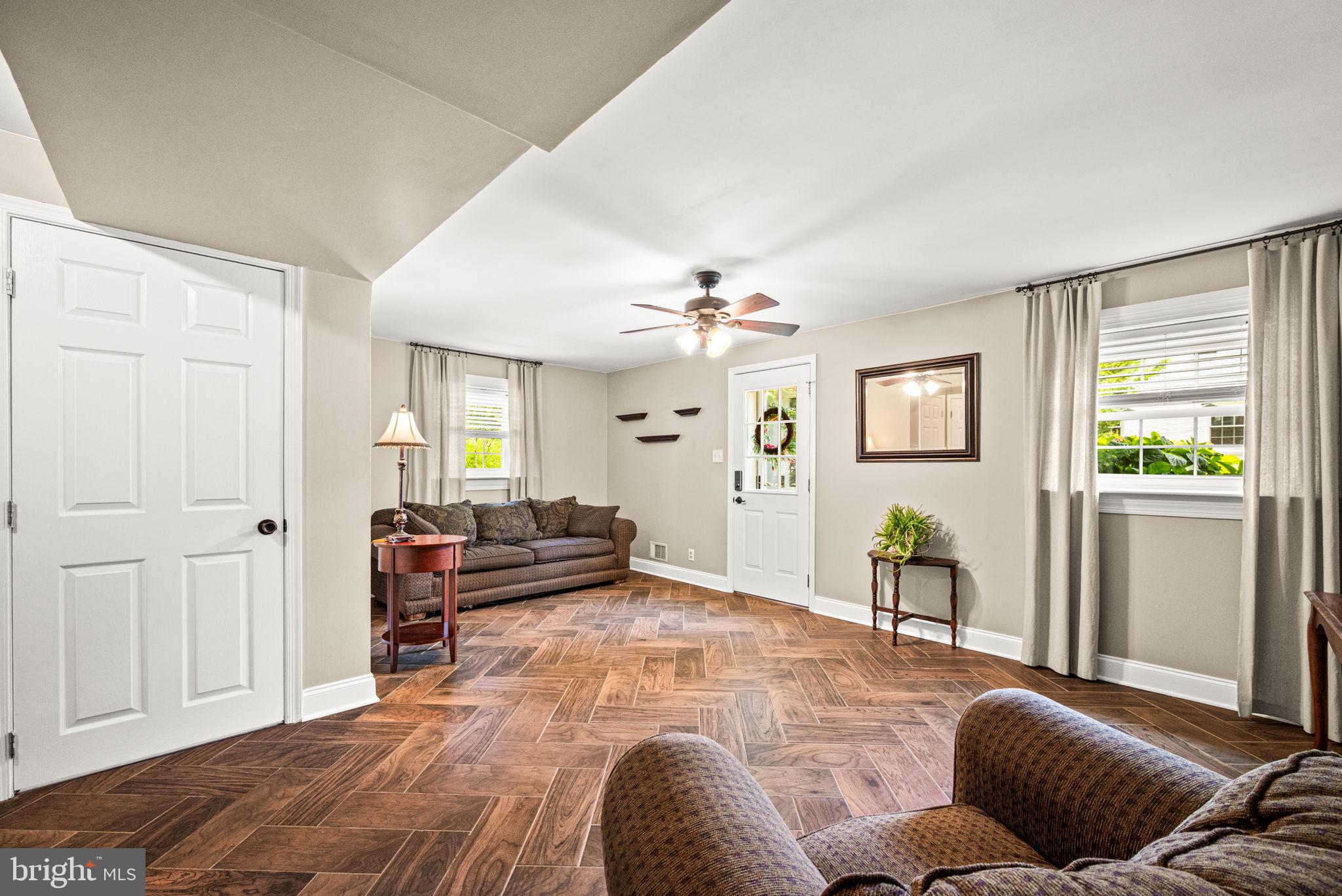 107 Lombardy Drive Wallingford, PA 19086 - Photo 19 of 36 a living room with furniture and a window
