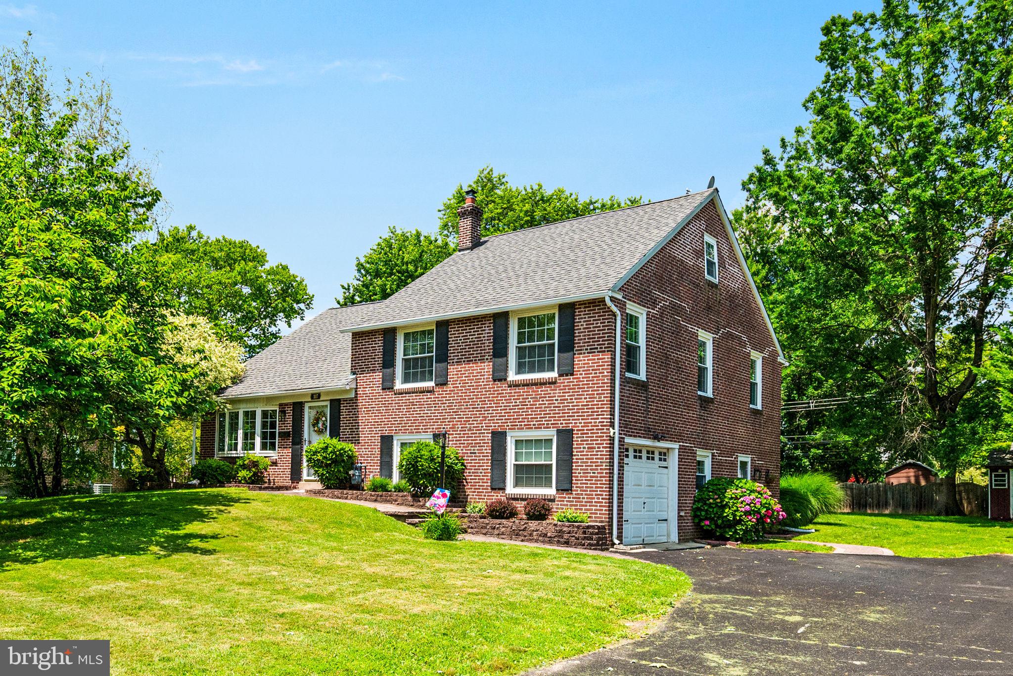 107 Lombardy Drive Wallingford, PA 19086 - Photo 2 of 36 a aerial view of a house with a yard