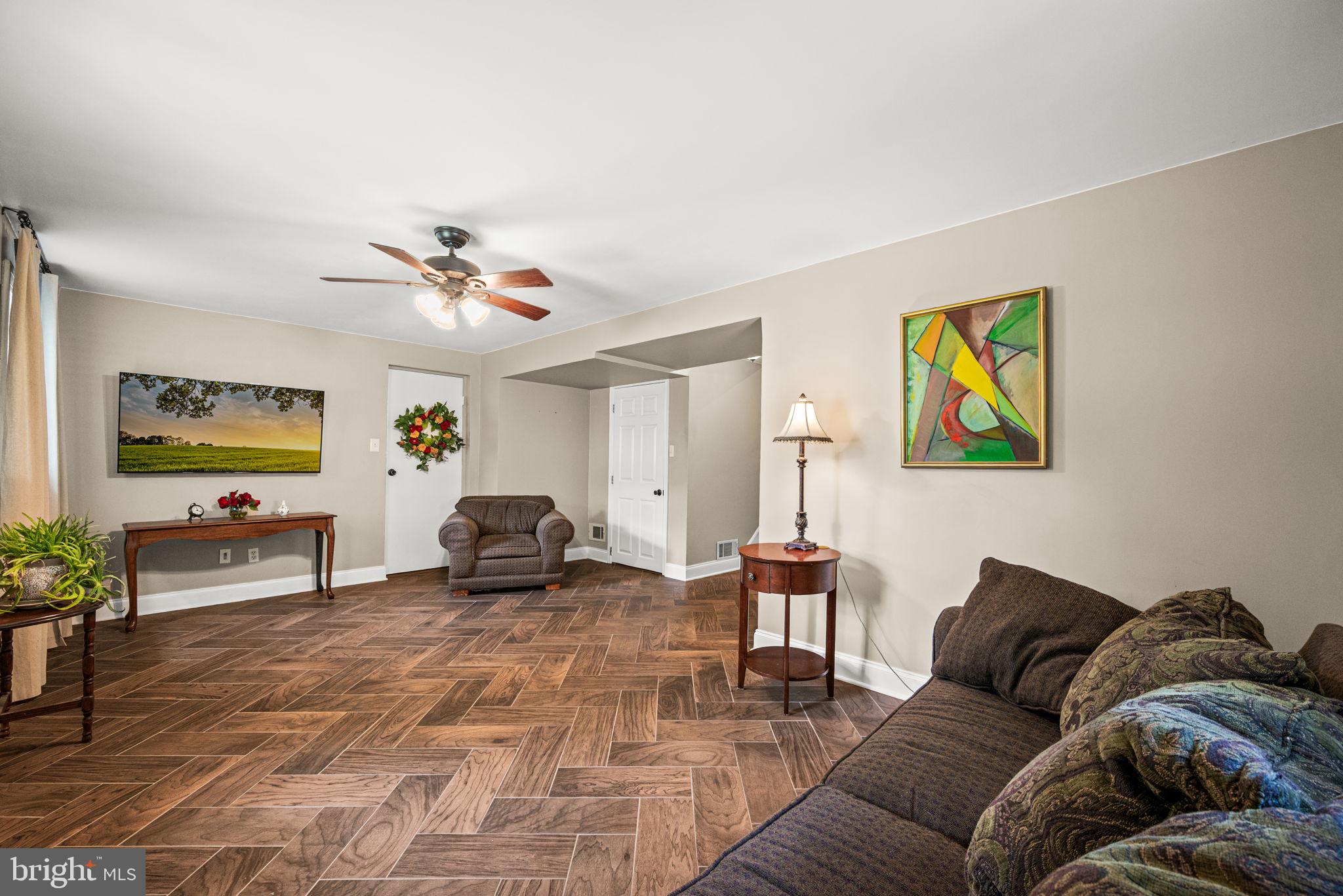 107 Lombardy Drive Wallingford, PA 19086 - Photo 21 of 36 a living room with furniture and a flat screen tv