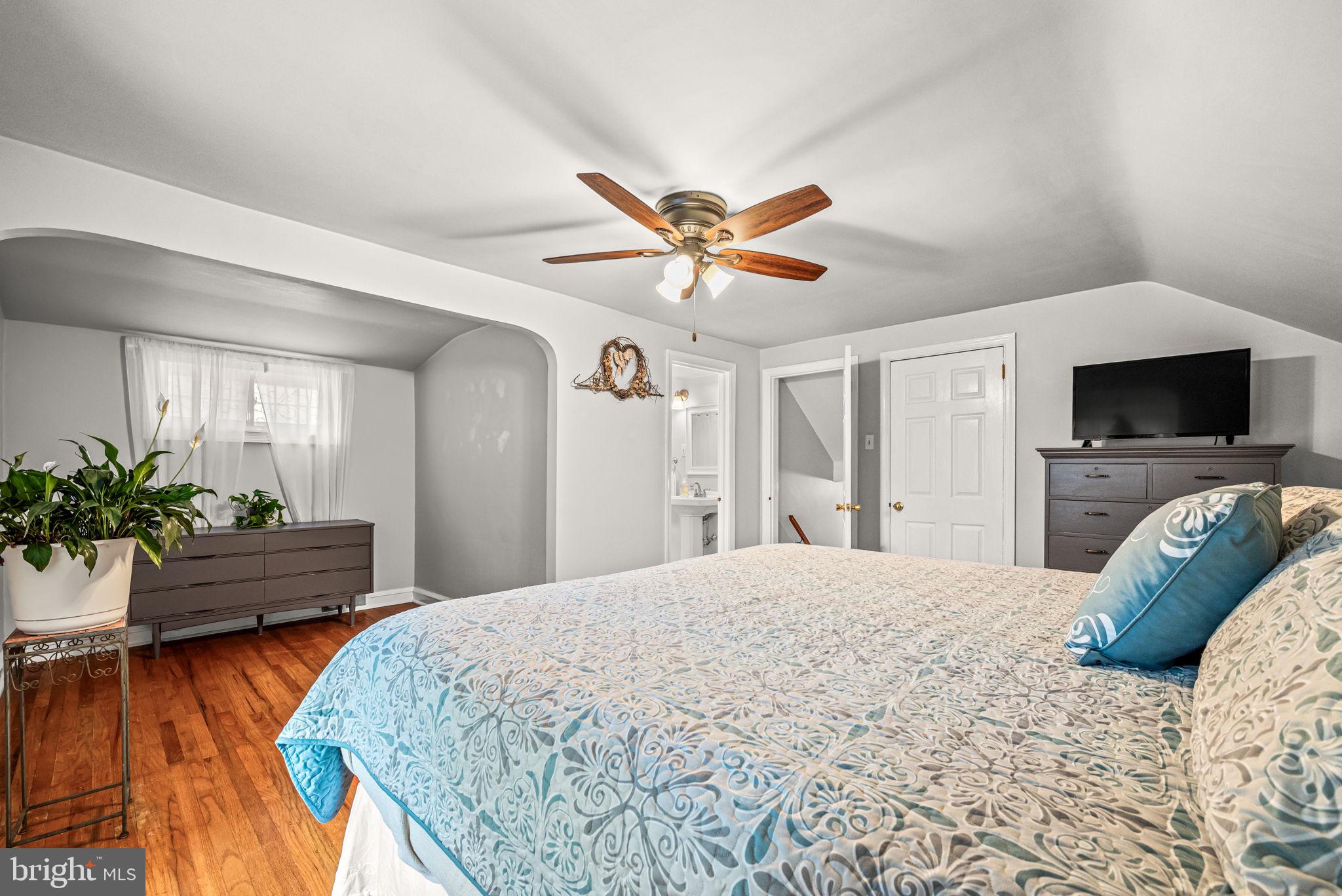 107 Lombardy Drive Wallingford, PA 19086 - Photo 29 of 36 a bedroom with a bed and a flat screen tv