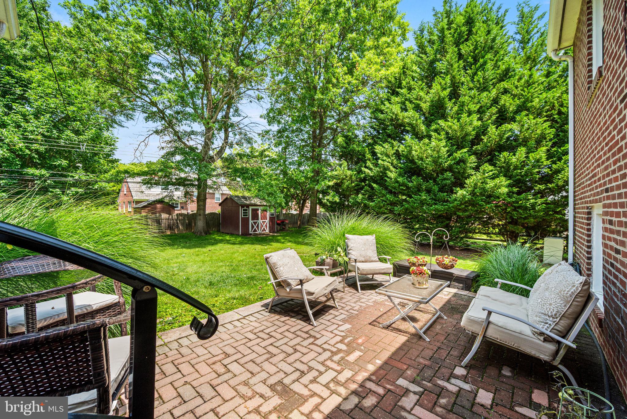 107 Lombardy Drive Wallingford, PA 19086 - Photo 33 of 36 a view of a patio with a yard