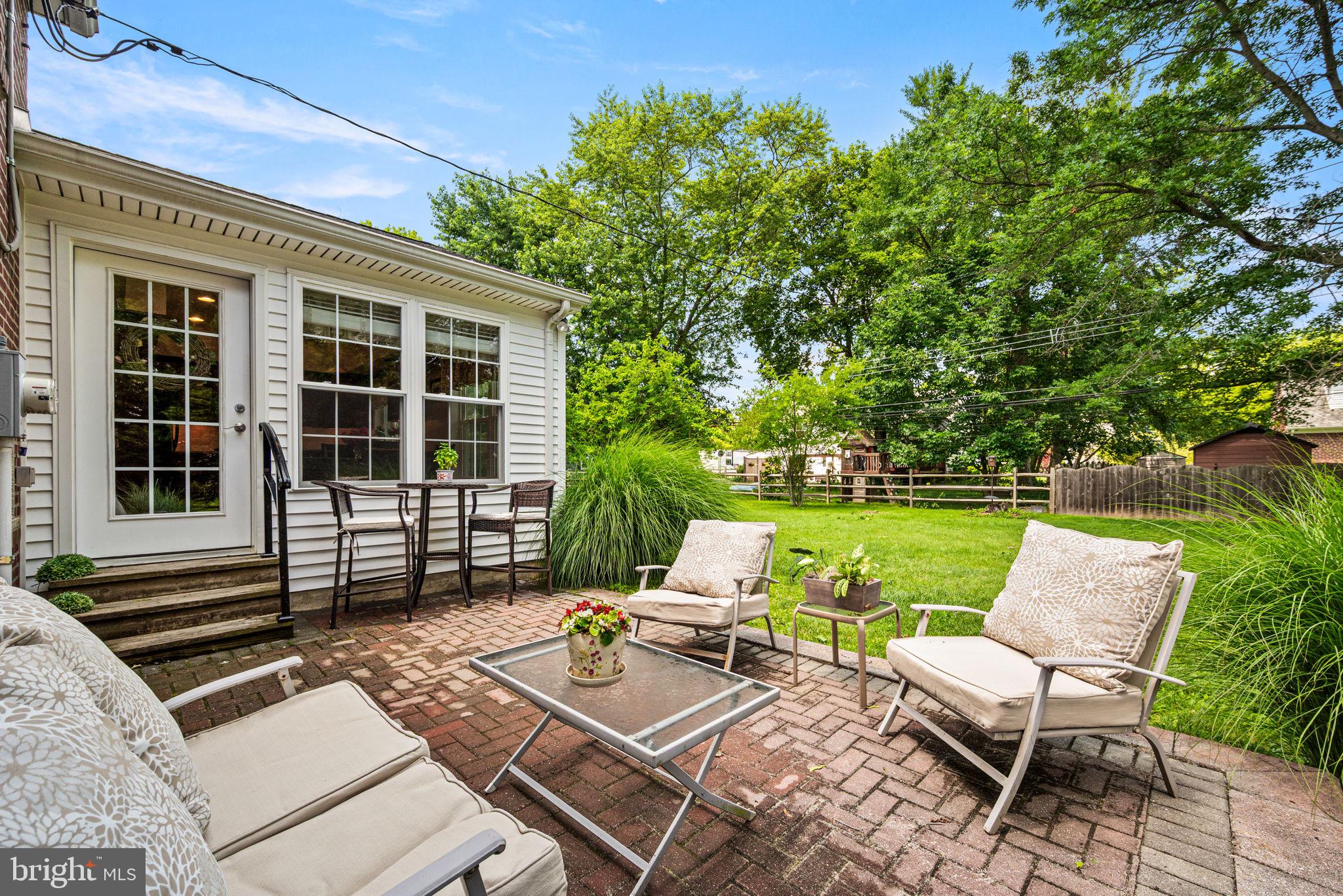 107 Lombardy Drive Wallingford, PA 19086 - Photo 34 of 36 a view of backyard of house with seating space