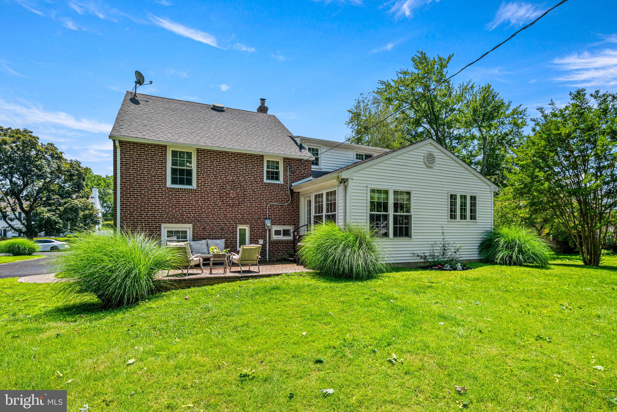 107 Lombardy Drive Wallingford, PA 19086 - Photo 35 of 36 a view of a house with a yard and sitting area