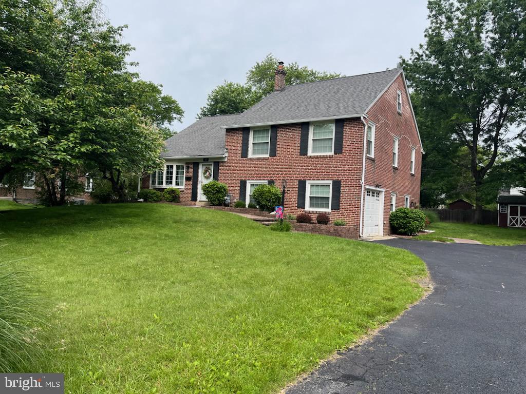 107 Lombardy Drive Wallingford, PA 19086 - Photo 36 of 36 front view of a house with a yard