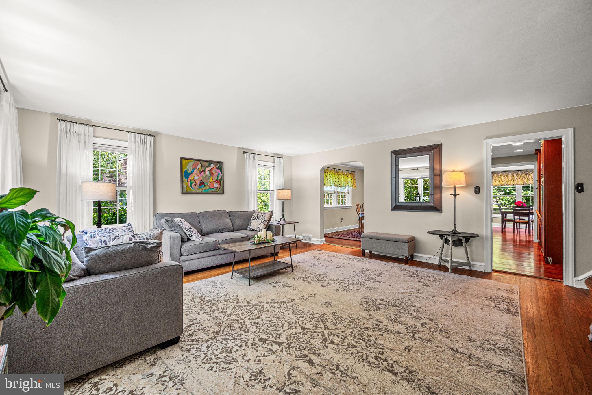 107 Lombardy Drive Wallingford, PA 19086 - Photo 4 of 36 a living room with furniture and a wooden floor