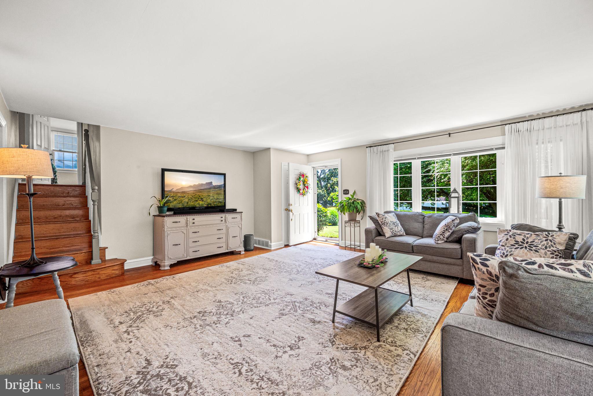 107 Lombardy Drive Wallingford, PA 19086 - Photo 5 of 36 a living room with furniture and a flat screen tv