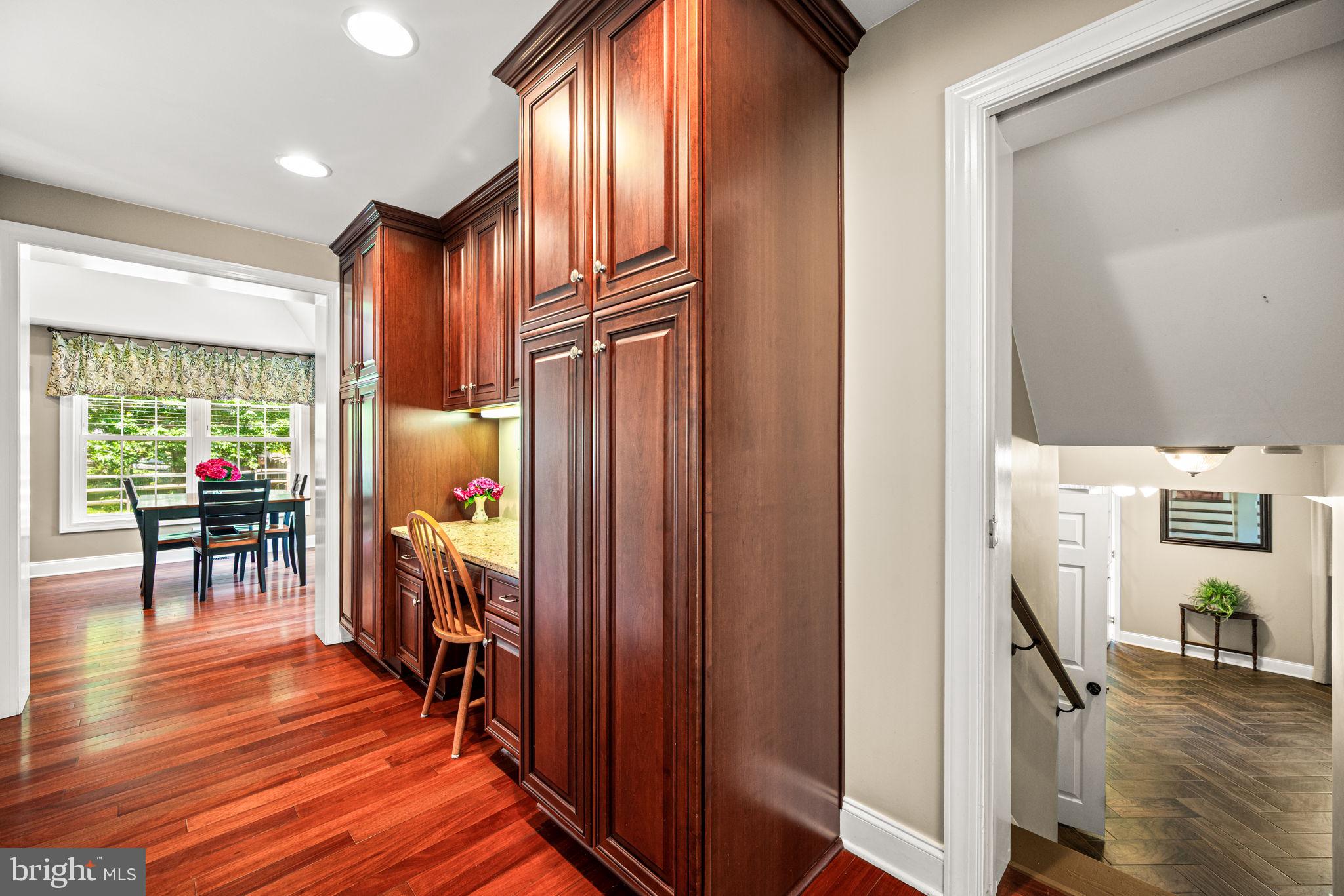 107 Lombardy Drive Wallingford, PA 19086 - Photo 9 of 36 a view of a hallway with furniture and wooden floor