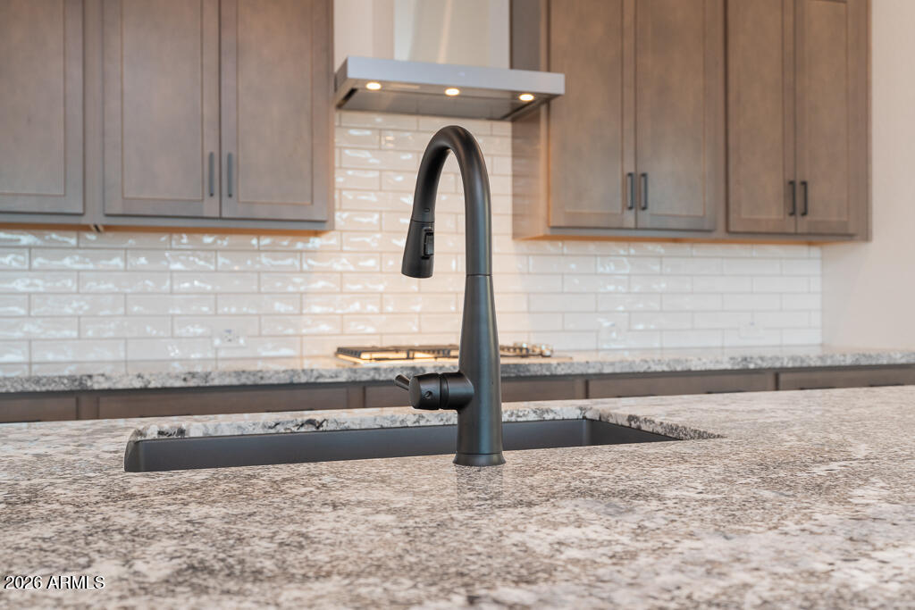 2260 Foremaster Road San Tan Valley, AZ 85140 - Photo 3 of 16 a close view of a sink and a dishwasher in a kitchen
