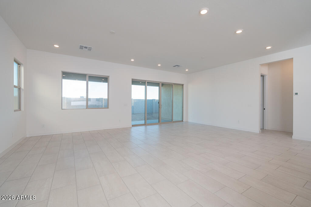 2260 Foremaster Road San Tan Valley, AZ 85140 - Photo 4 of 16 an empty room with windows and entrance