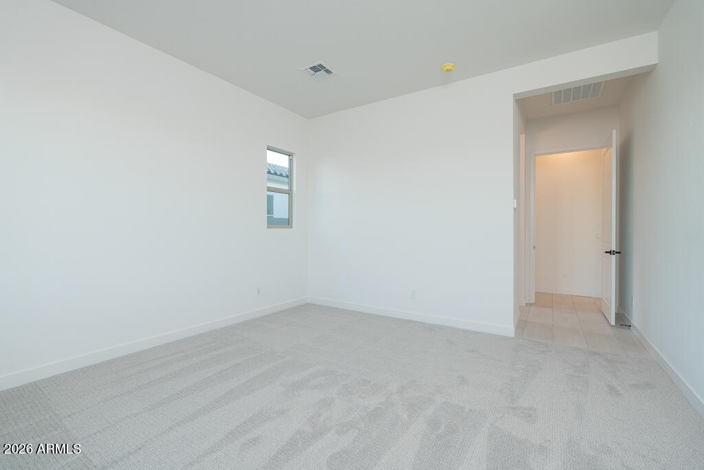 2260 Foremaster Road San Tan Valley, AZ 85140 - Photo 5 of 16 an empty room with a empty space and window