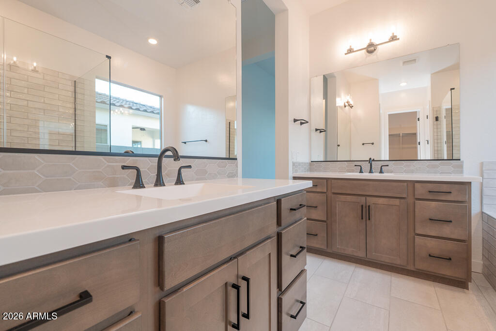 2260 Foremaster Road San Tan Valley, AZ 85140 - Photo 6 of 16 a spacious bathroom with a granite countertop sink mirror and double