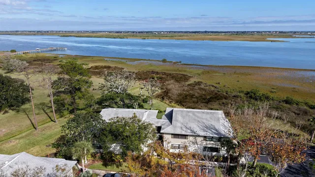 an aerial view of residential building and ocean