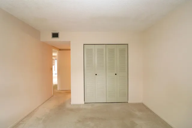 a bathroom with a toilet and shower
