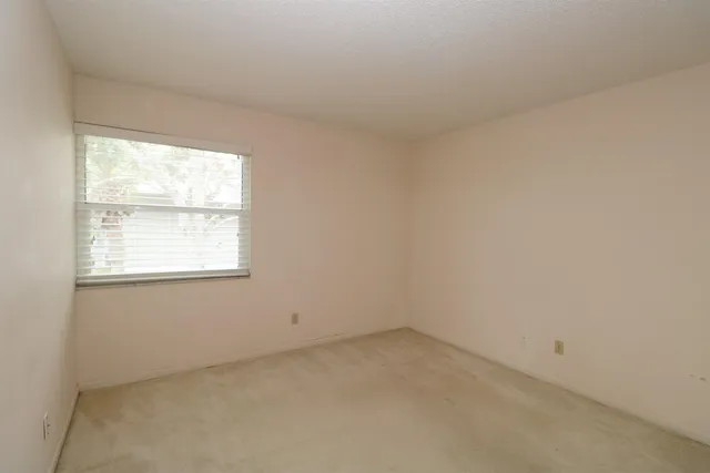 a bathroom with a toilet a sink and shower