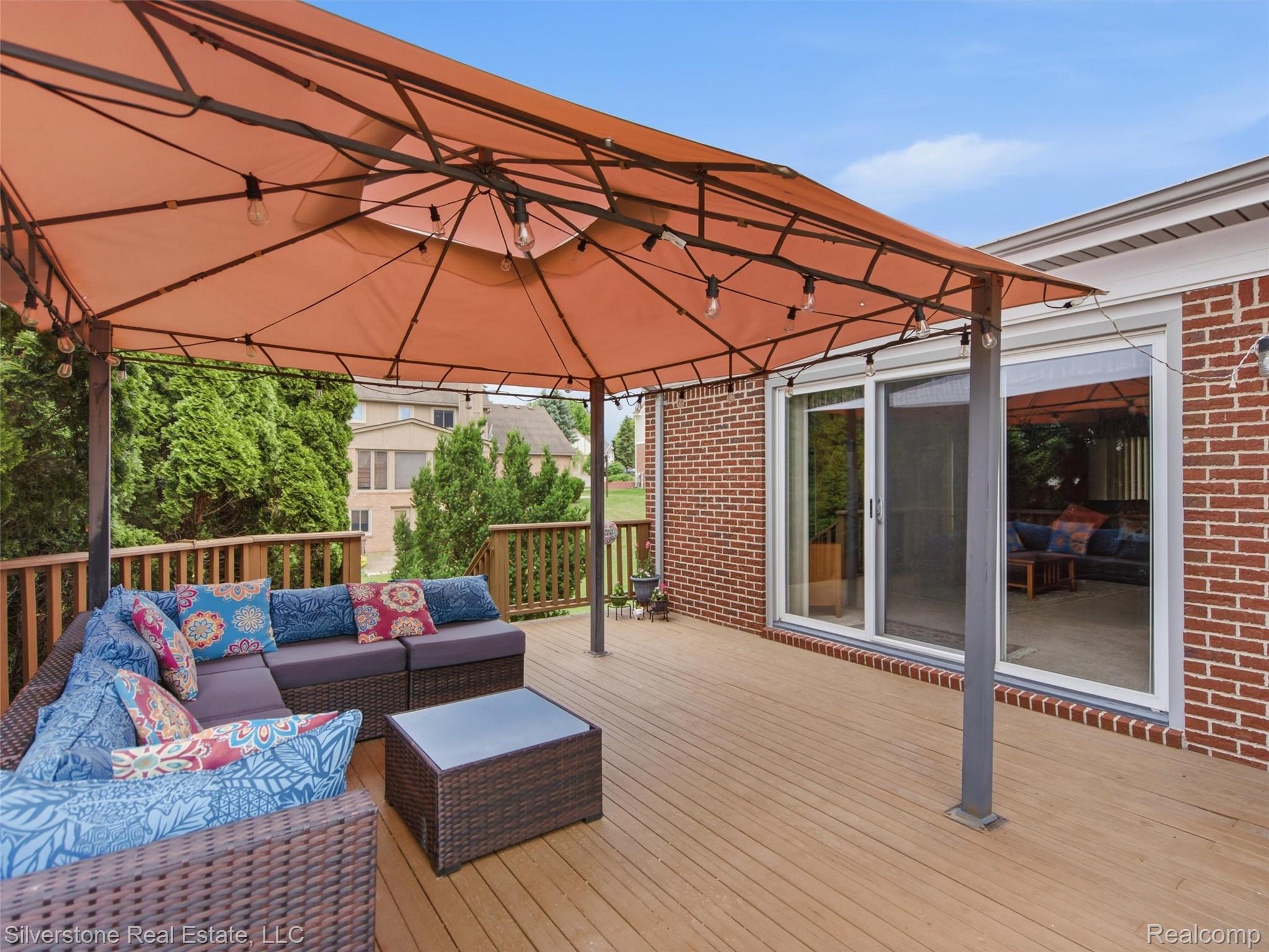 6577 Edith Court Troy, MI 48085 - Photo 51 of 61 Spacious outdoor deck featuring wood-finish flooring and a wood railing