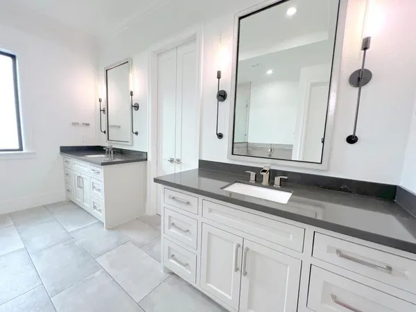 a bathroom with a granite countertop sink a mirror and a