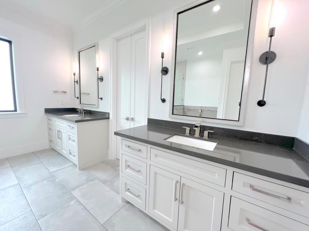 2122 Blalock Road, Unit C Houston, TX 77080 - Photo 25 of 45 a bathroom with a granite countertop sink a mirror and a