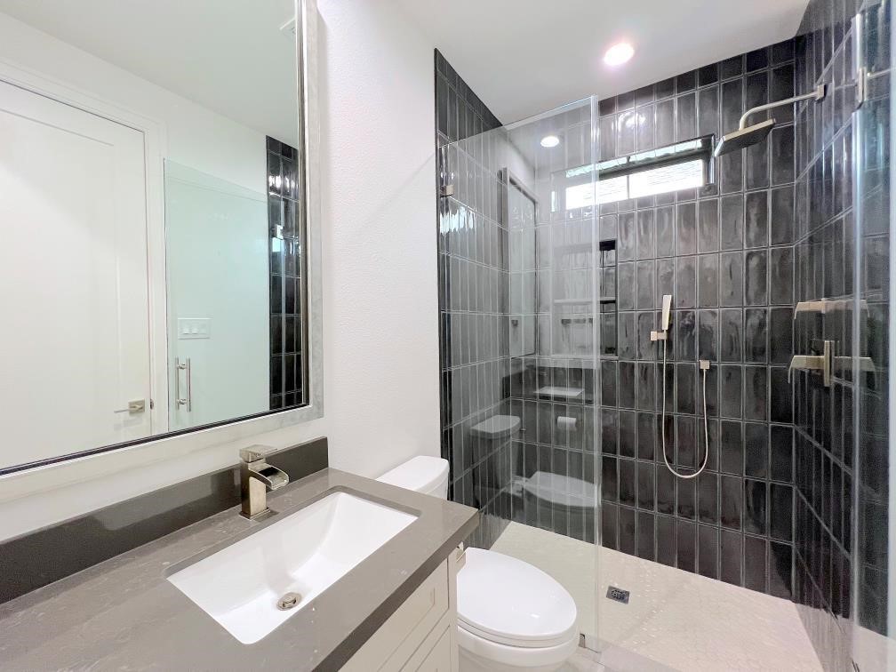 2122 Blalock Road, Unit C Houston, TX 77080 - Photo 39 of 45 a bathroom with a sink a toilet and shower