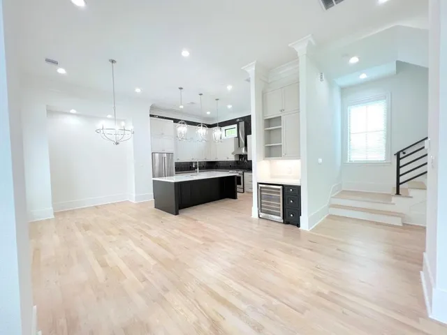 a view of kitchen and refrigerator