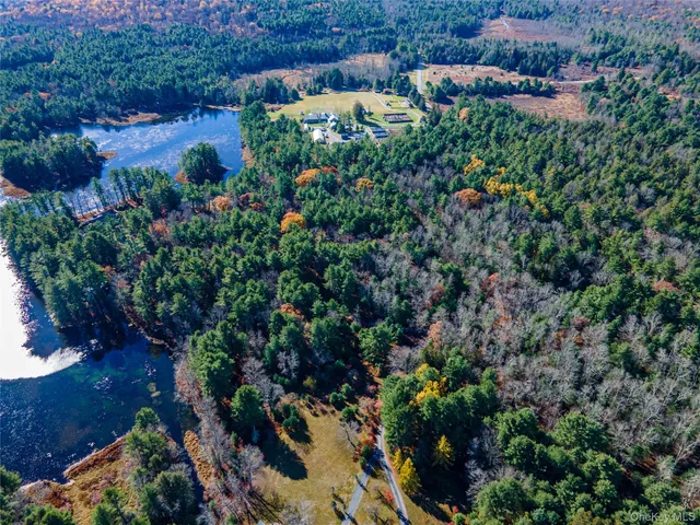 a view of a house with a yard and garden