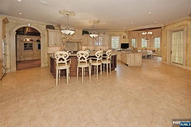 a view of a dining area with furniture and chandelier
