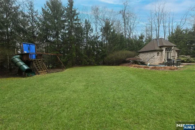 a view of a table and chairs under an umbrella