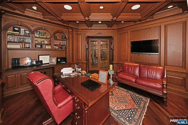 a outdoor living space with furniture and a flat screen tv