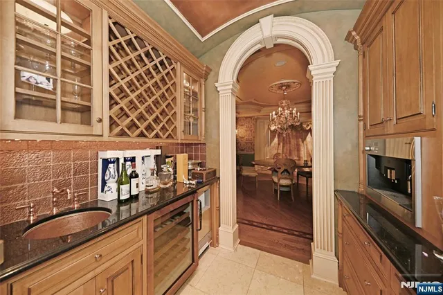 a view of a kitchen with a sink and cabinets