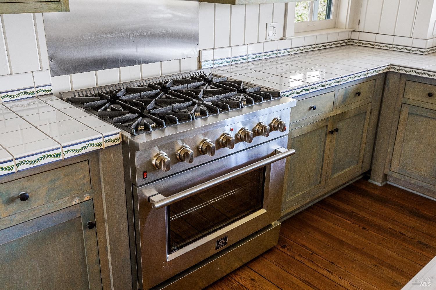 13700 Rockpile Road Geyserville, CA 95441 - Photo 41 of 64 a close view of a stove top oven sitting inside of a kitchen