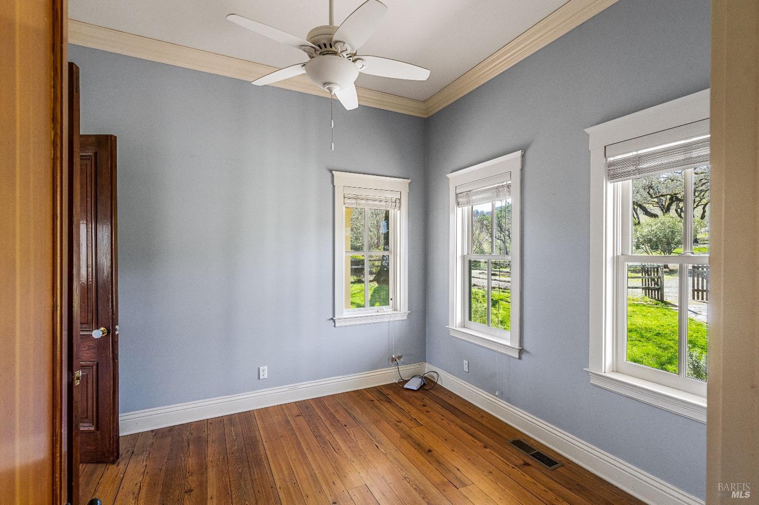 13700 Rockpile Road Geyserville, CA 95441 - Photo 46 of 64 a view of an empty room with wooden floor and a window