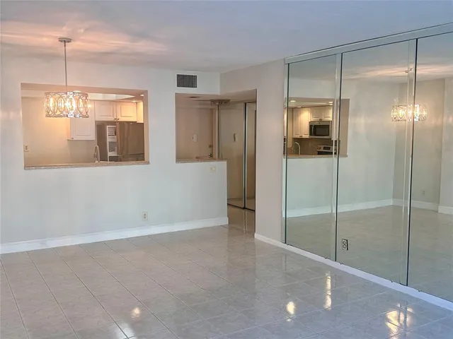a view of a room with window and wooden floor