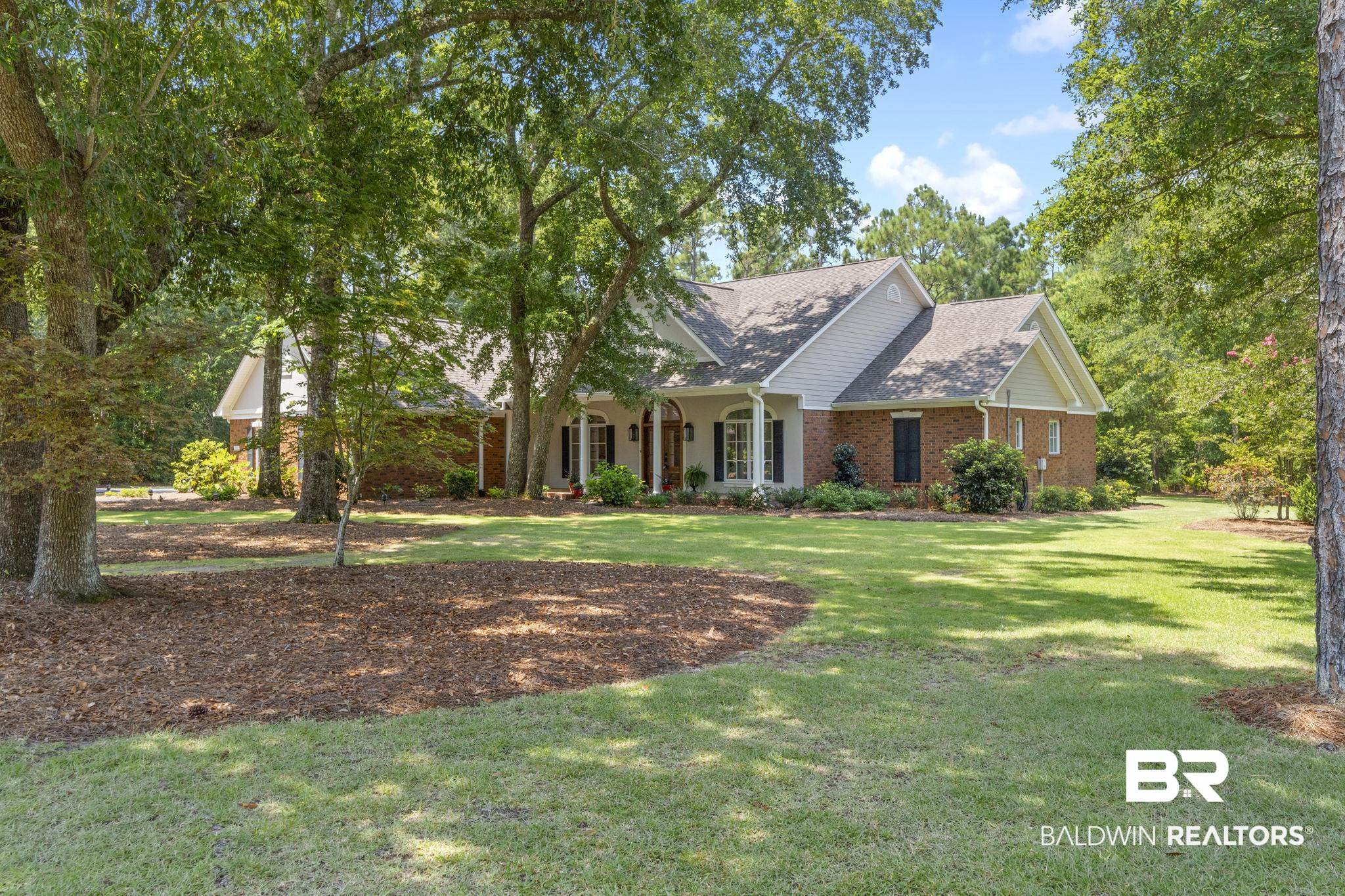 4451 Millhouse Road Gulf Shores, AL 36542 - Photo 3 of 50 View of front of house with a front yard
