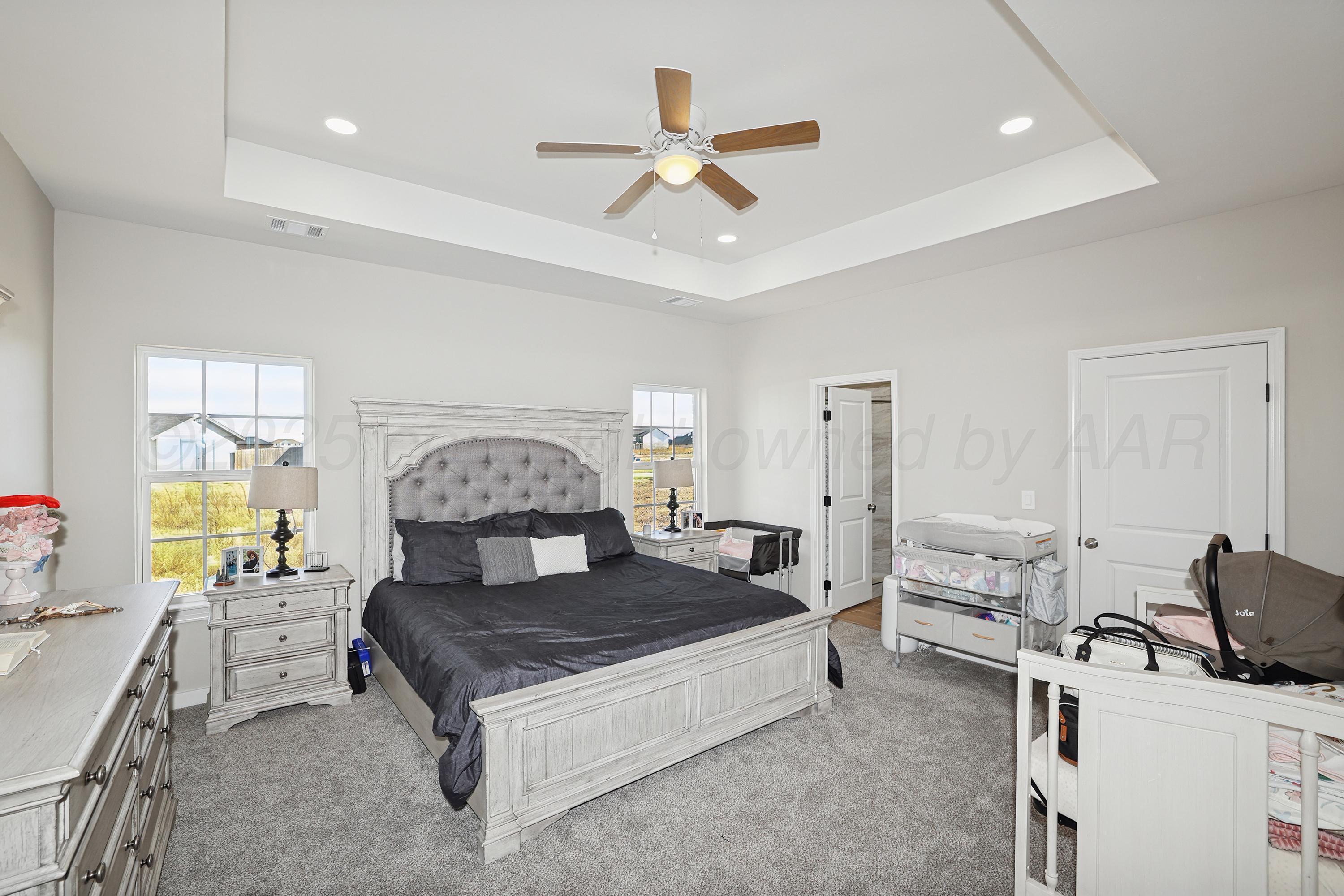 10250 Piper Lane Amarillo, TX 79119 - Photo 11 of 21 a living room with a bed furniture and a large window