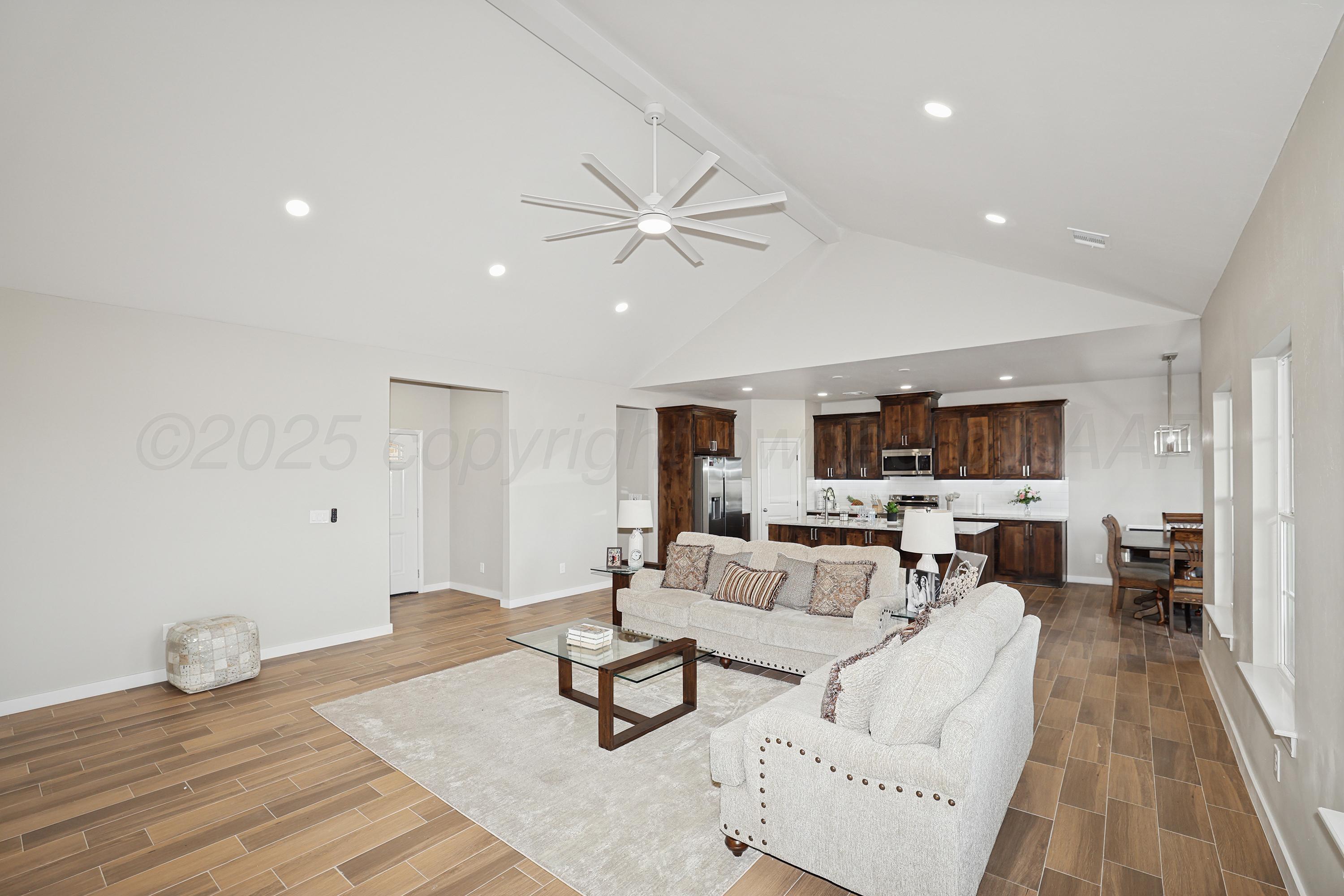 10250 Piper Lane Amarillo, TX 79119 - Photo 6 of 21 a living room with furniture and a wooden floor