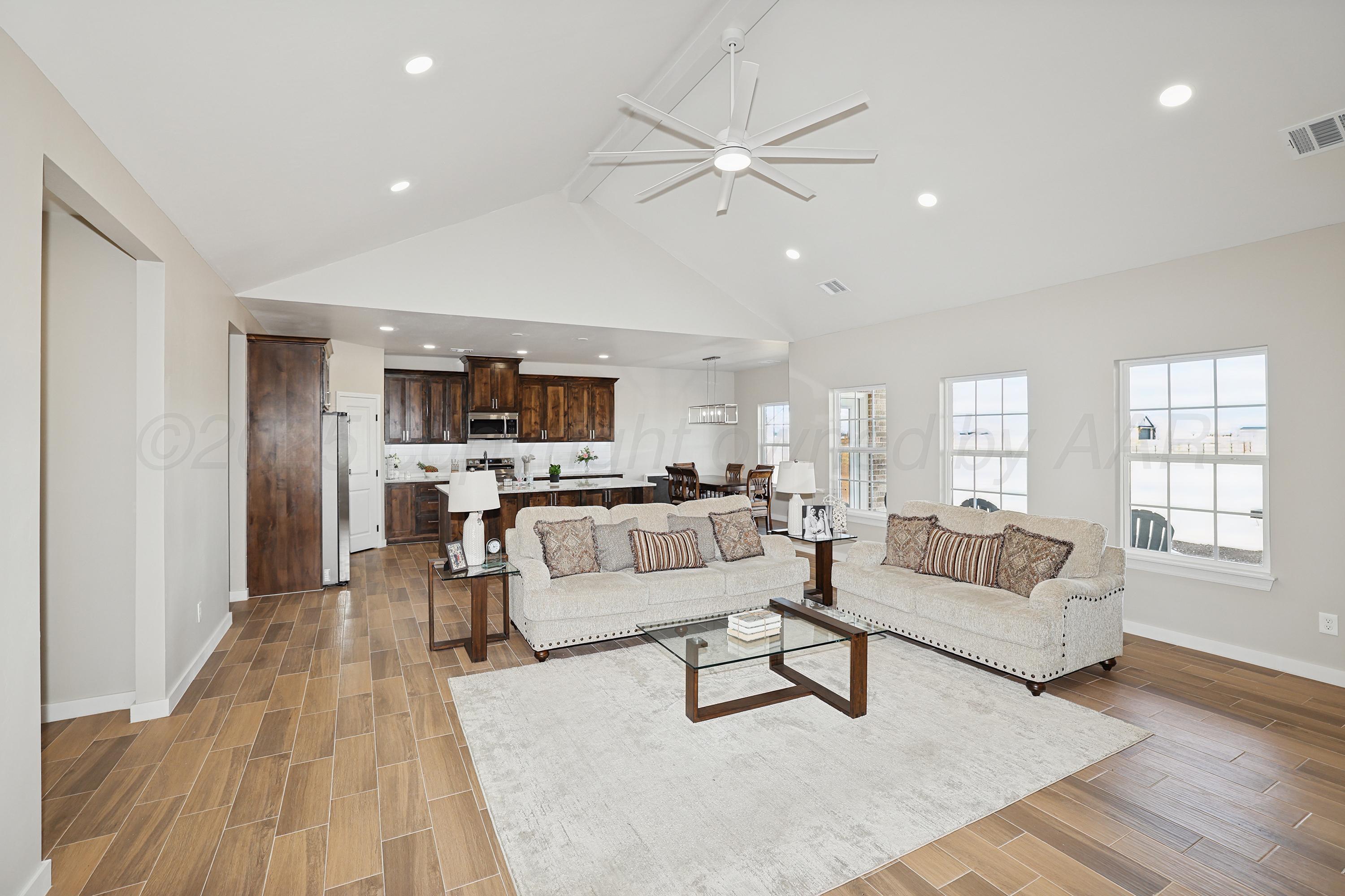 10250 Piper Lane Amarillo, TX 79119 - Photo 7 of 21 a living room with furniture and view of kitchen
