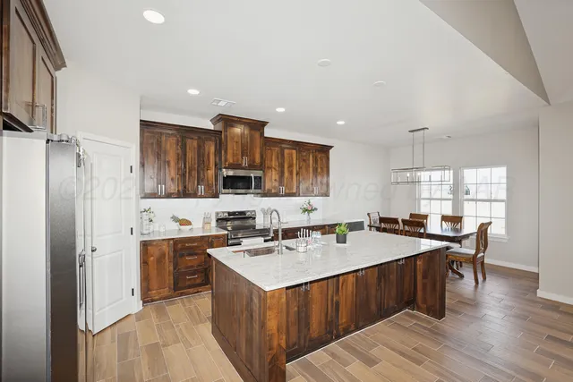 a kitchen with a sink stove and cabinets