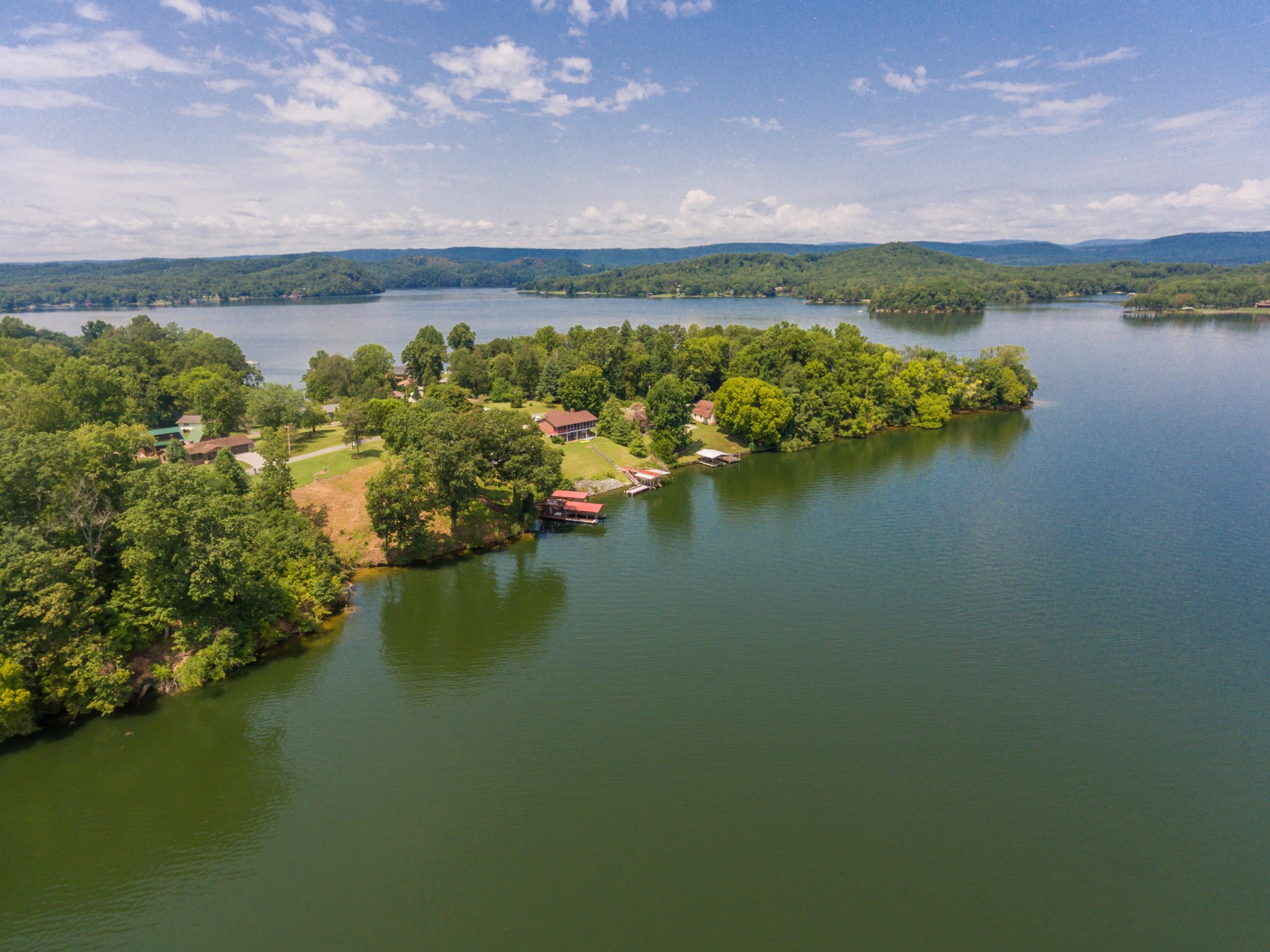 364 Hilltop Road Spring City, TN 37381 - Photo 5 of 18 a view of a lake with a city