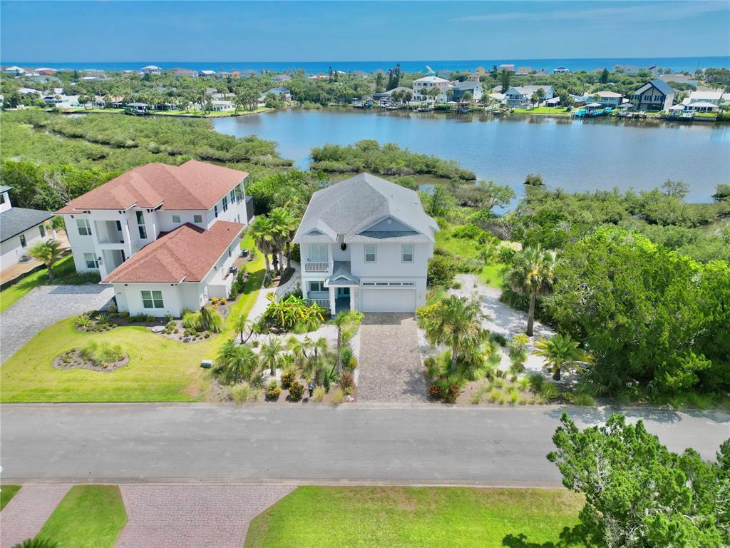 2569 Palm Avenue Flagler Beach, FL 32136 - Photo 1 of 69 an aerial view of a house with outdoor space and lake view