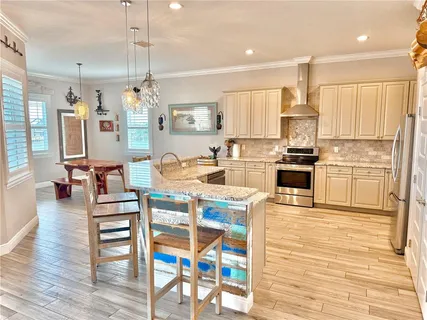 a bedroom with furniture and a wooden floor