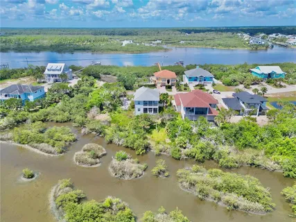 an aerial view of a house with a lake view