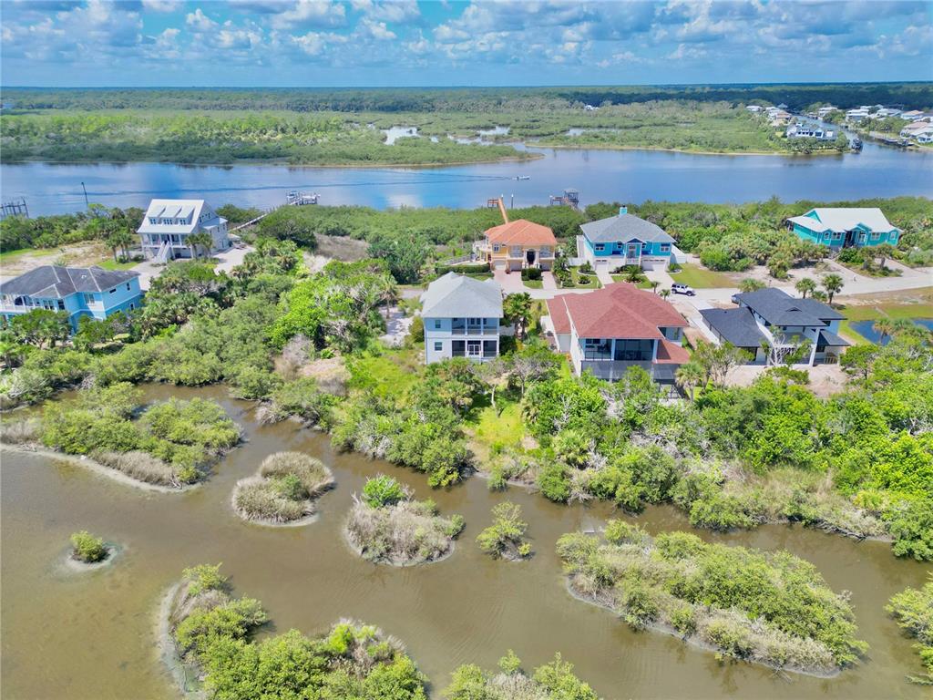 2569 Palm Avenue Flagler Beach, FL 32136 - Photo 2 of 69 an aerial view of a house with a lake view